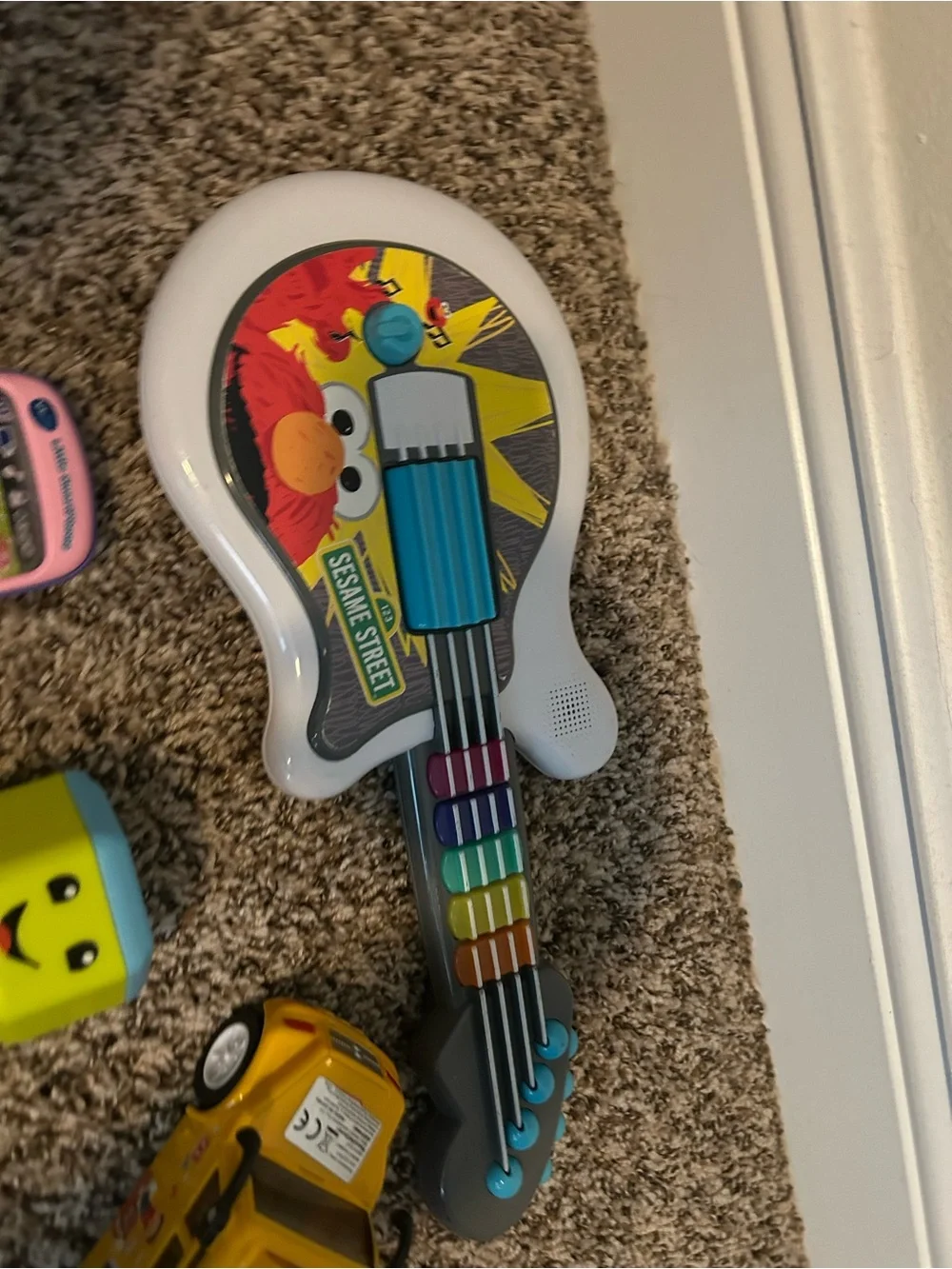 4 Assorted Kids Toys - Elmo guitar, tech phone, fisher price weight, music bus